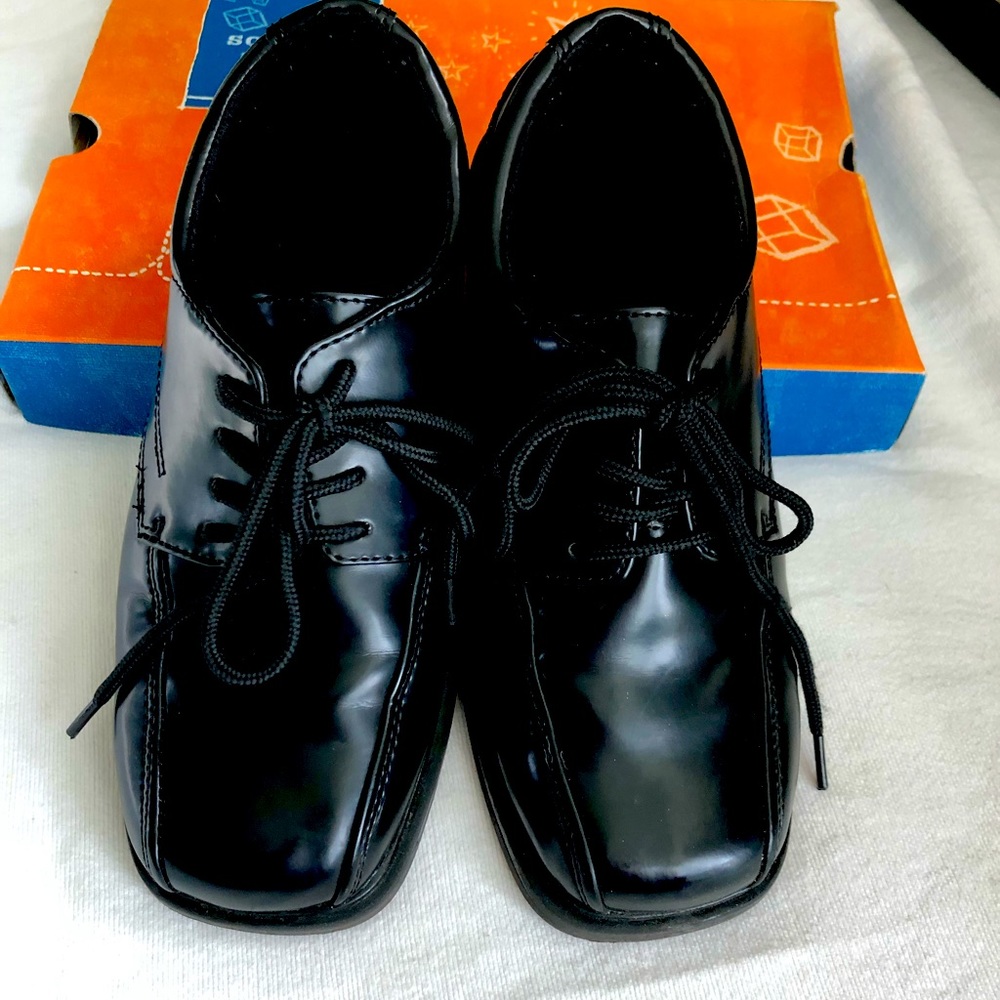 Boys size 4 black dress shoes.